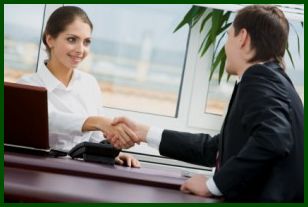 Personal sales interaction between saleswoman and customer.