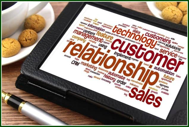 Image of red words relating to customer relationships on a tablet.